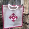 Medium white jute bag with pink motif - Image 2